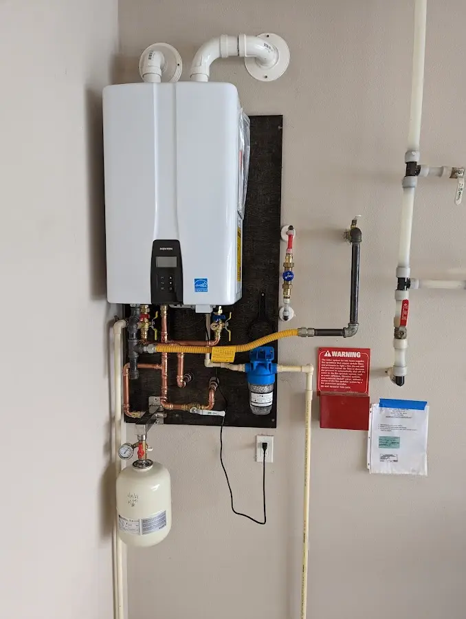 Professional plumber installing copper piping in a Hutto home